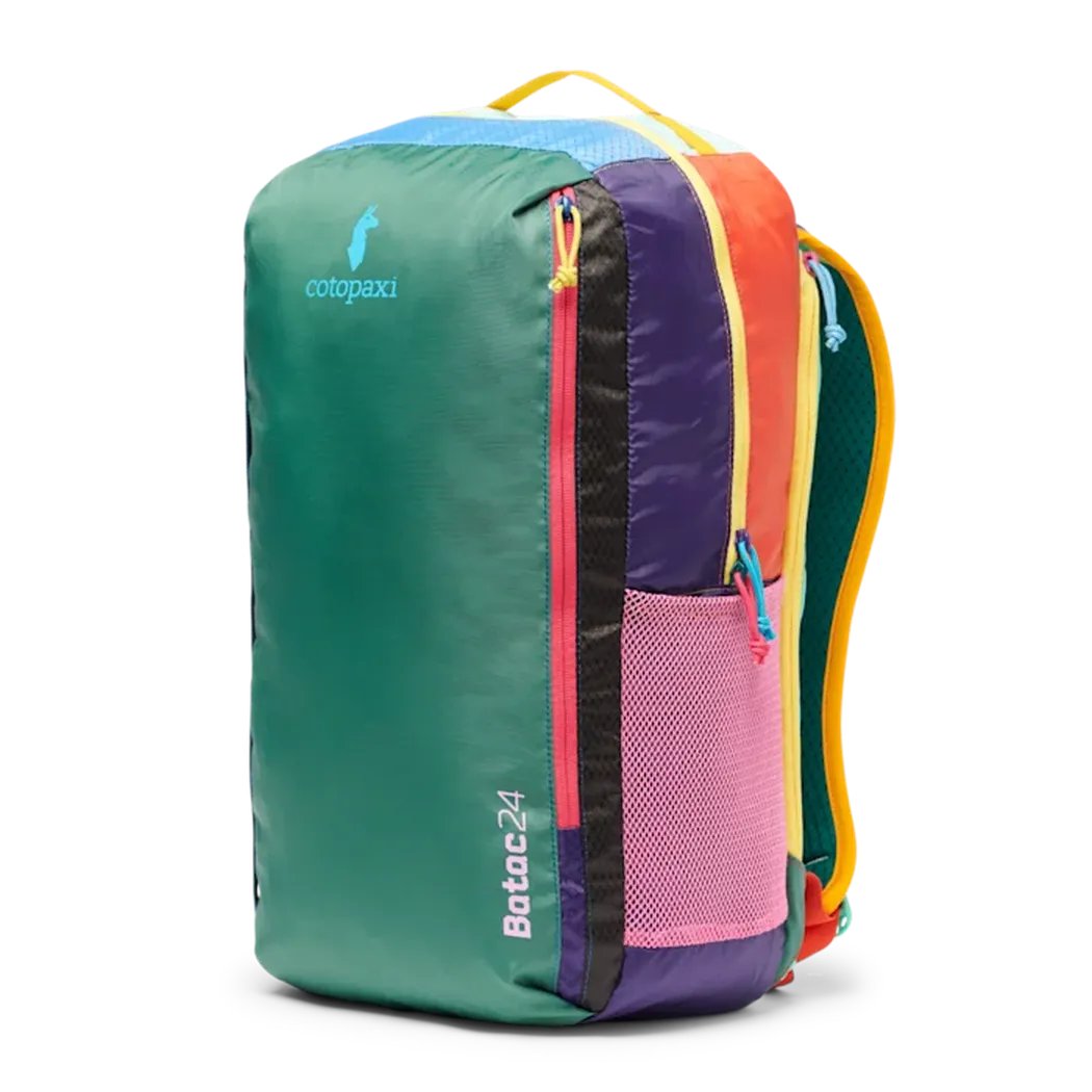 A front view of the Cotopaxi Batac 24L Pack in Del Dia II with a pink mesh pocket and colorful zippers against a white background.