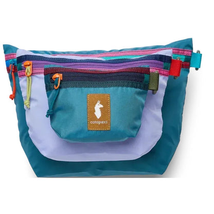 A front view of the Cotopaxi Cubo Pouch Organizers in Del Dia showing the front pocket and zippers against a white background.