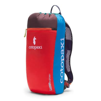 Side view of the Cotopaxi Luzon 18L Daypack Del Dia with red, blue and charcoal top against a white background.