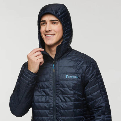 A front view of the Cotopaxi Men's Capa Insulated Hooded jacket in Carbon with the hood up against a plain white background.