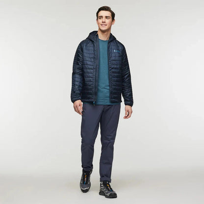 A front view of the Cotopaxi Men's Capa Insulated Hooded jacket in Carbon on a model against a plain white background.