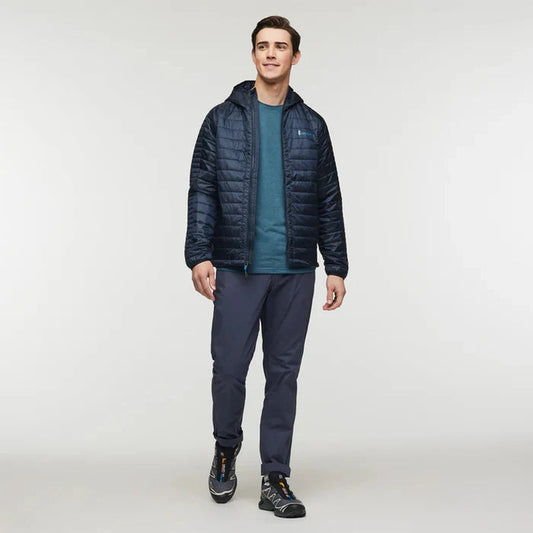 A front view of the Cotopaxi Men's Capa Insulated Hooded jacket in Carbon on a model against a plain white background.