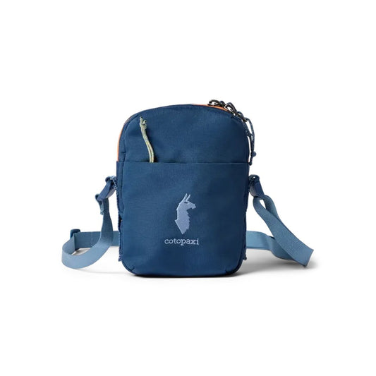 A front view of the blue Cotopaxi Todo 1L Shoulder Bag with a front pocket and shoulder straps against a white background.