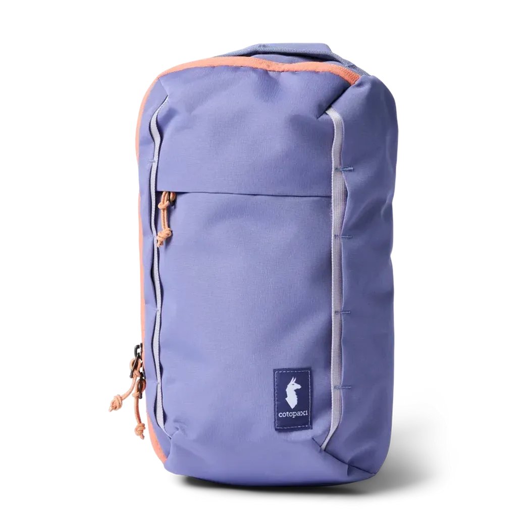 A front view of the Cotopaxi Todo 8L Sling in Aster showing the front pocket and logo against a white background.