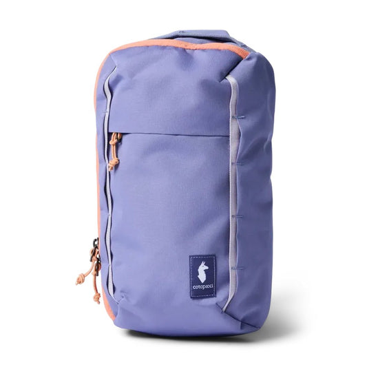 A front view of the Cotopaxi Todo 8L Sling in Aster showing the front pocket and logo against a white background.