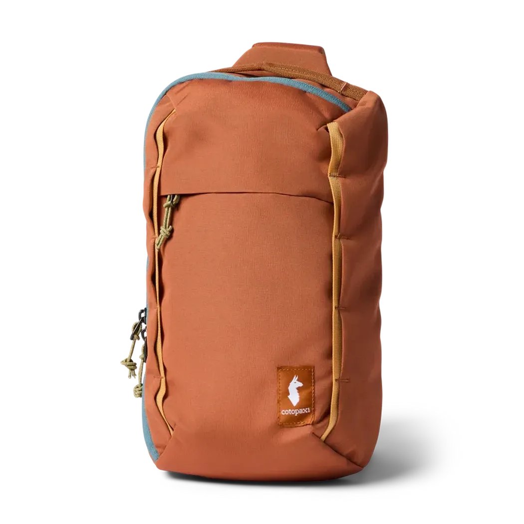 A front view of the Cotopaxi Todo 8L Sling in Aster showing the front pocket and logo against a white background.