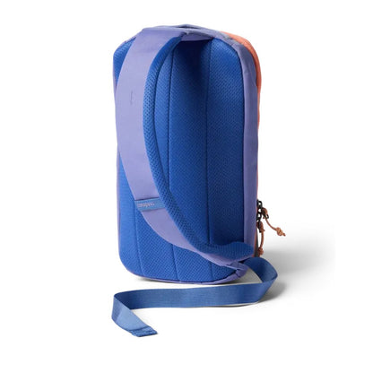 Side view of the Cotopaxi Todo 8L Sling in Aster showing the padded shoulder strap and blue bottom strap against a white background.