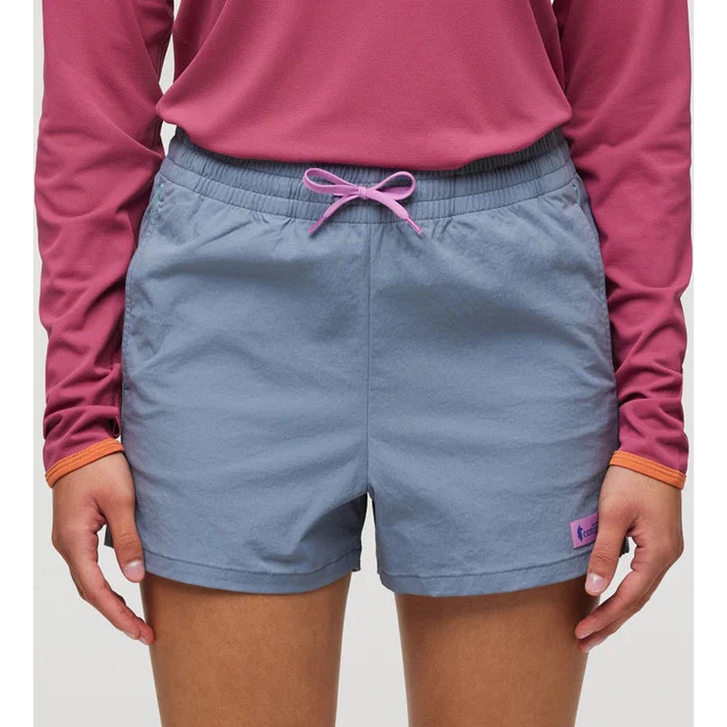 A front view of the Cotopaxi Women's Brinco Short in Tempest color with a pink drawstring and a small purple tag on the right leg.