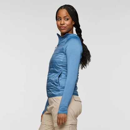 Side view of the Cotopaxi Women's Capa Hybrid Insulated Jacket in Fjord showing the model wearing it against a plain background.