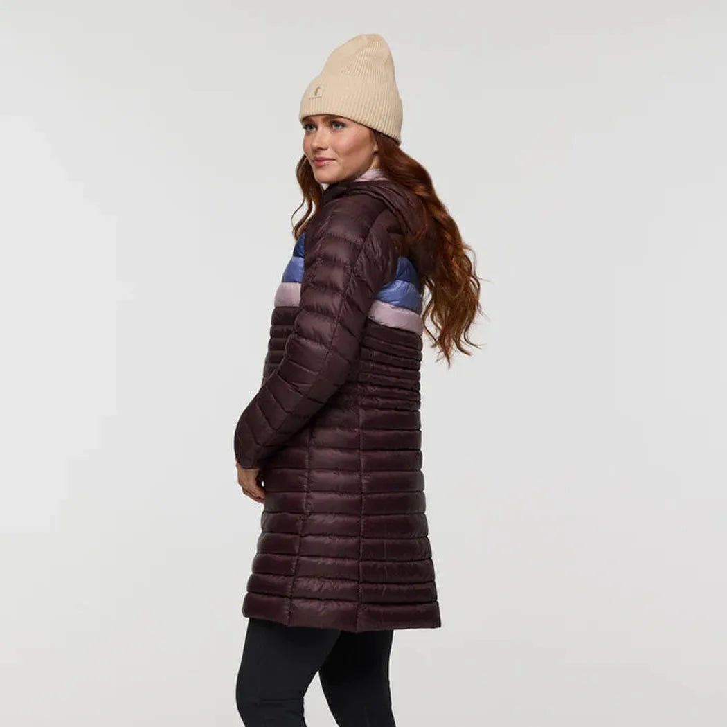 Side view of the Cotopaxi Women's Fuego Down Parka in Coffee Stripes on a model against a plain white background.