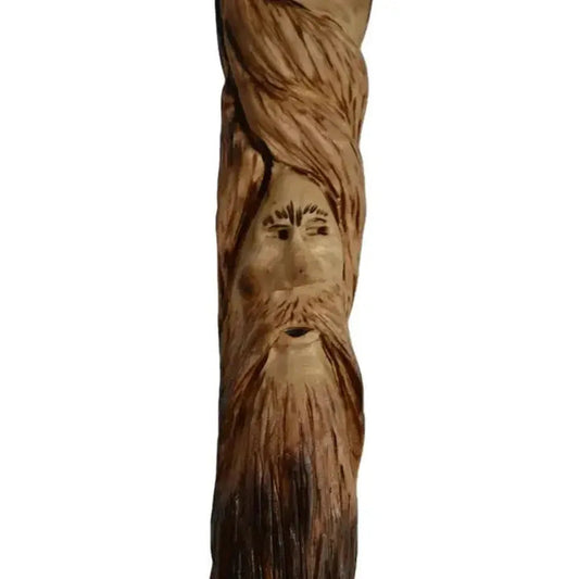 A vertical photo of the Creation Carvings Wood Walking Stick with Wood Spirit Carving in Sweetgum showing the detailed wood spirit face and beard against a plain white background.