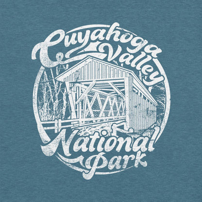 A heather deep teal Cuyahoga Valley Clothing Company CVNP Covered Bridge T - Shirt with a white graphic of a covered bridge and text.