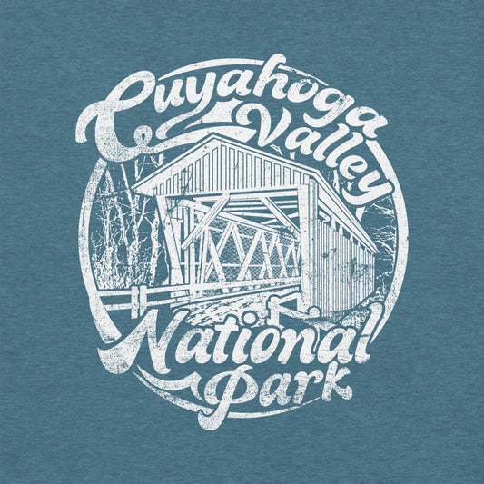 A heather deep teal Cuyahoga Valley Clothing Company CVNP Covered Bridge T - Shirt with a white graphic of a covered bridge and text.
