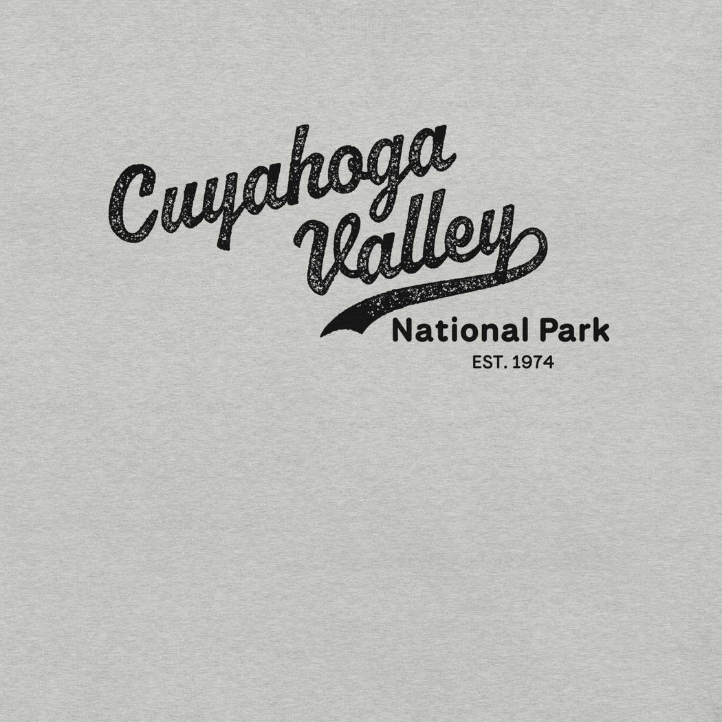 A front view of the Cuyahoga Valley Clothing Company CVNP Vintage Script T - Shirt in Athletic Heather showing the logo against a light gray background.