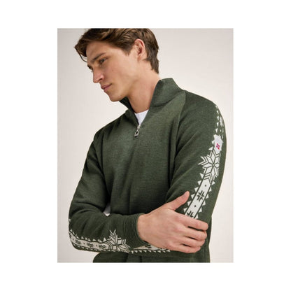 A side view of the Dale Of Norway Geilo Masc Sweater-SAMPLE in N color showing the patterned sleeves and a model wearing it against a light background.