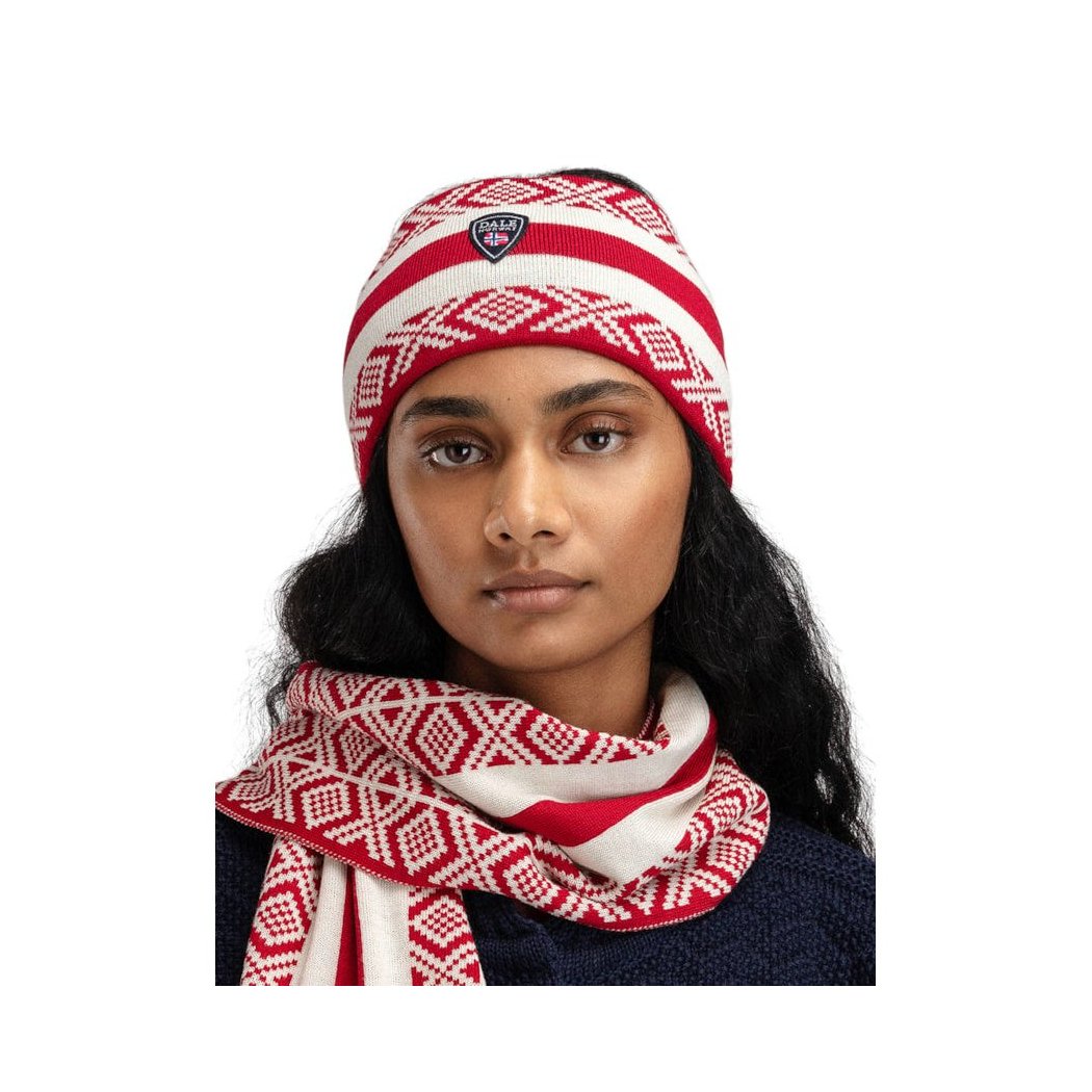 A model wears the Dale Of Norway Kvitegga Headband-SAMPLE with a matching RaspOffWht scarf against a white background.