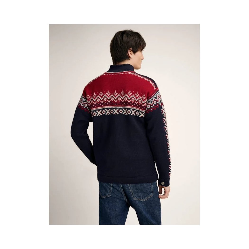 Back view of the Dale Of Norway Men's 140th Anniversary Sweater-SAMPLE in E color on a model wearing blue jeans against a plain background.