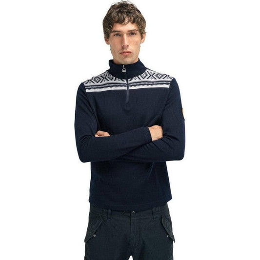A front view of the Dale Of Norway Men's Cortina Basic Sweater in Navy Off White with a patterned yoke and half-zip, worn by a model against a white background.