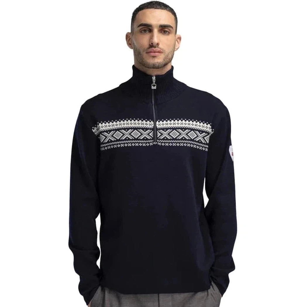 A front view of the Dale Of Norway Men's Dalestølen Sweater in Navy Offwhite with a patterned chest panel and zip neck, on a model against a white background.