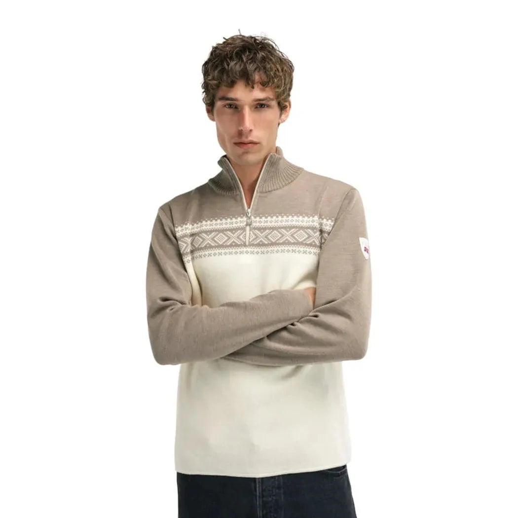 A front view of the Dale Of Norway Men's Dalestølen Sweater in Navy Offwhite with a zip neck and patterned chest panel, worn by a model against a white background.