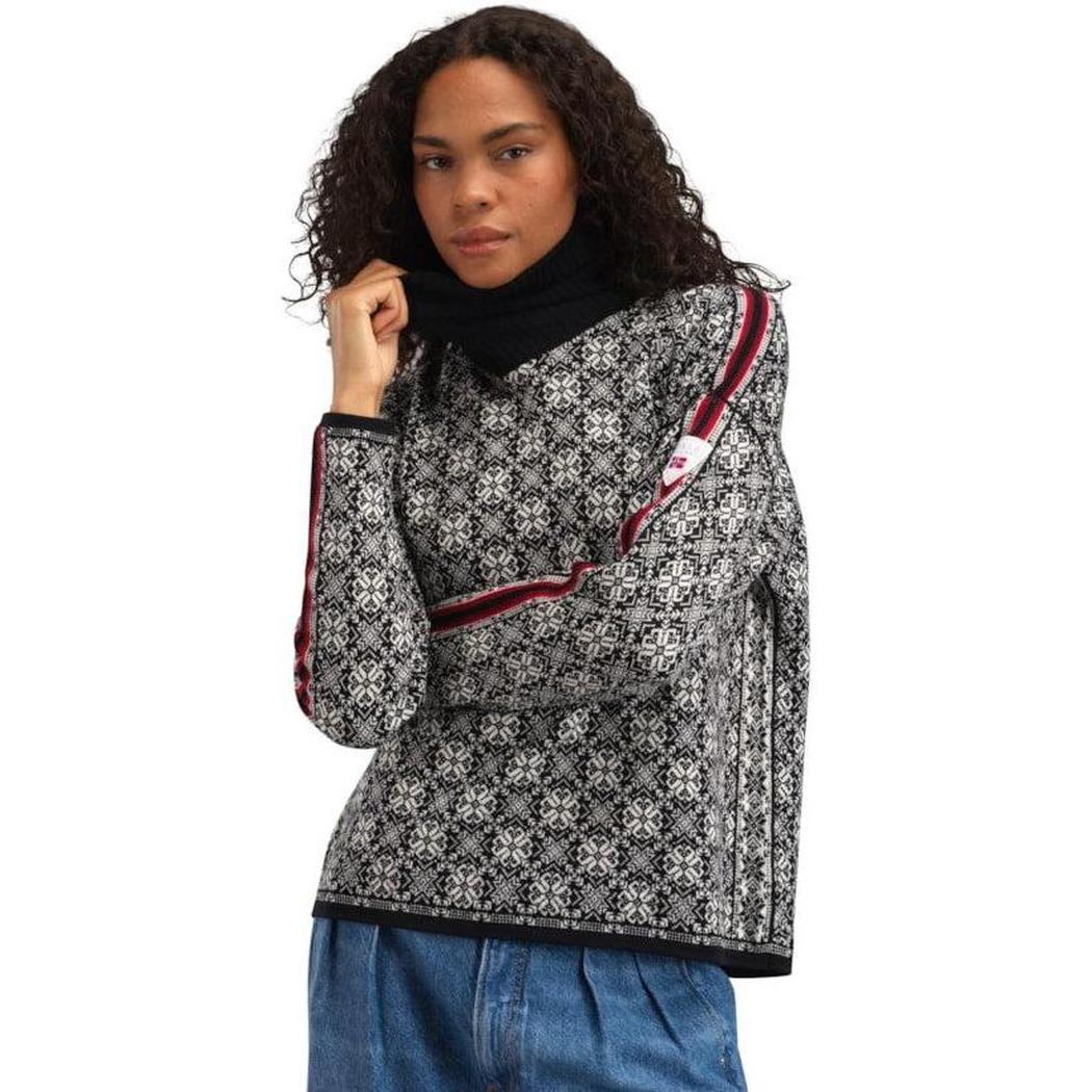 A model wears the Dale Of Norway Women's Firda Sweater in Black Offwhite with a white background.