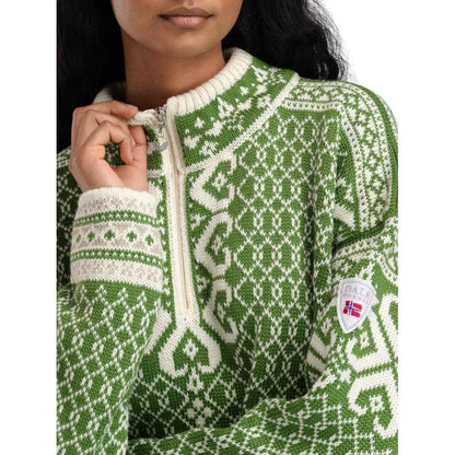 A close-up of the Dale Of Norway Women's Leknes Sweater in Springgreen Offwhite Sand Mel, showing the zipper and a model wearing it.