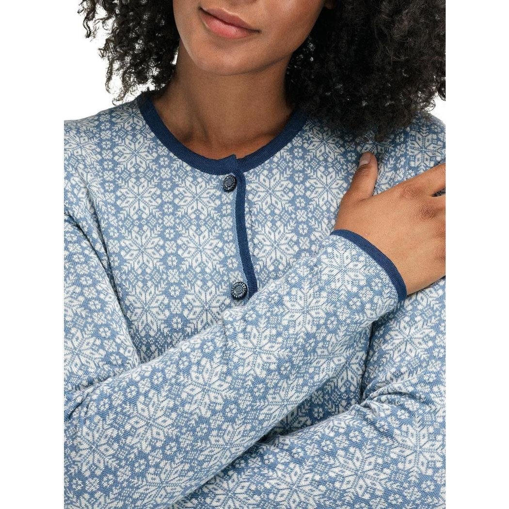 A model wears the Dale Of Norway Women's Othelie Jacket in Blueshadow Offwhite, showing the button front and long sleeves.