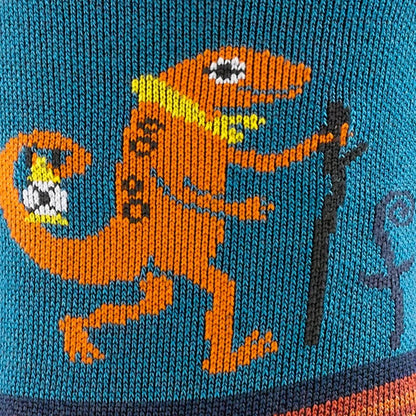 A close up of the Darn Tough Kid's Sal Micro Crew Lightweight With Cushion sock in Lava showing the orange lizard design on a blue background.