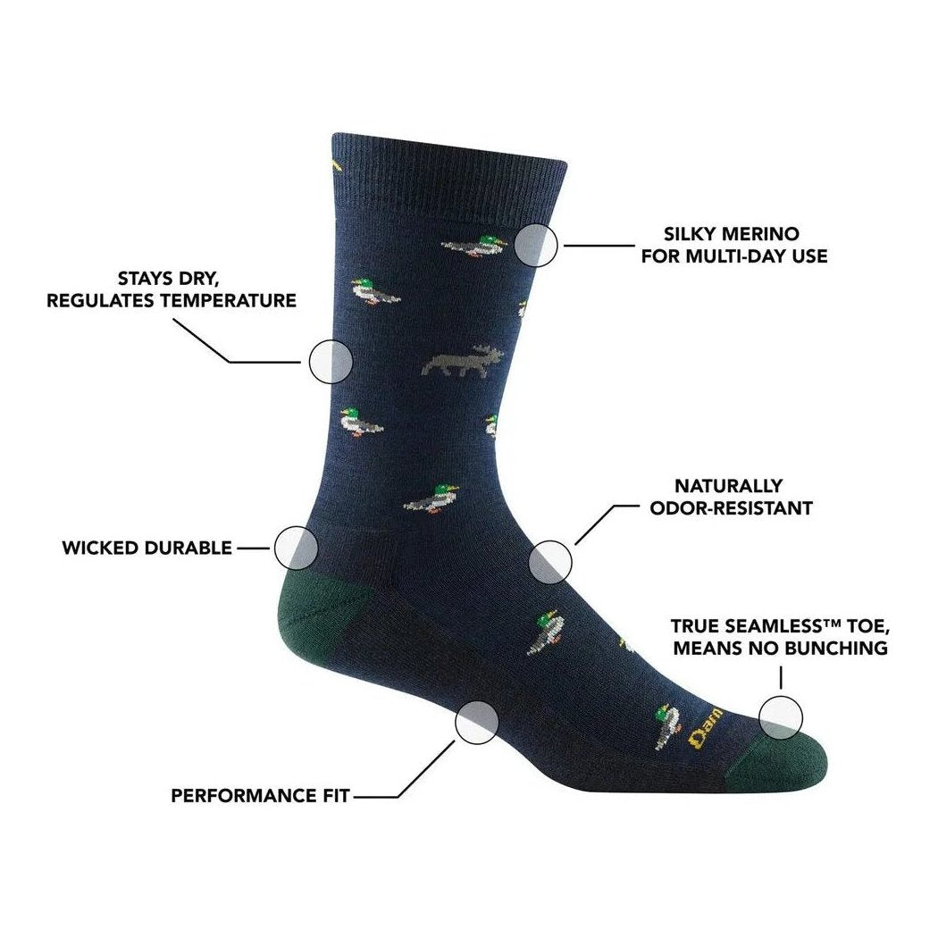 Side view of Darn Tough Men's Duck Duck Moose Crew Lightweight with Cushion socks in Eclipse showing the multi-day use feature and dark blue color.