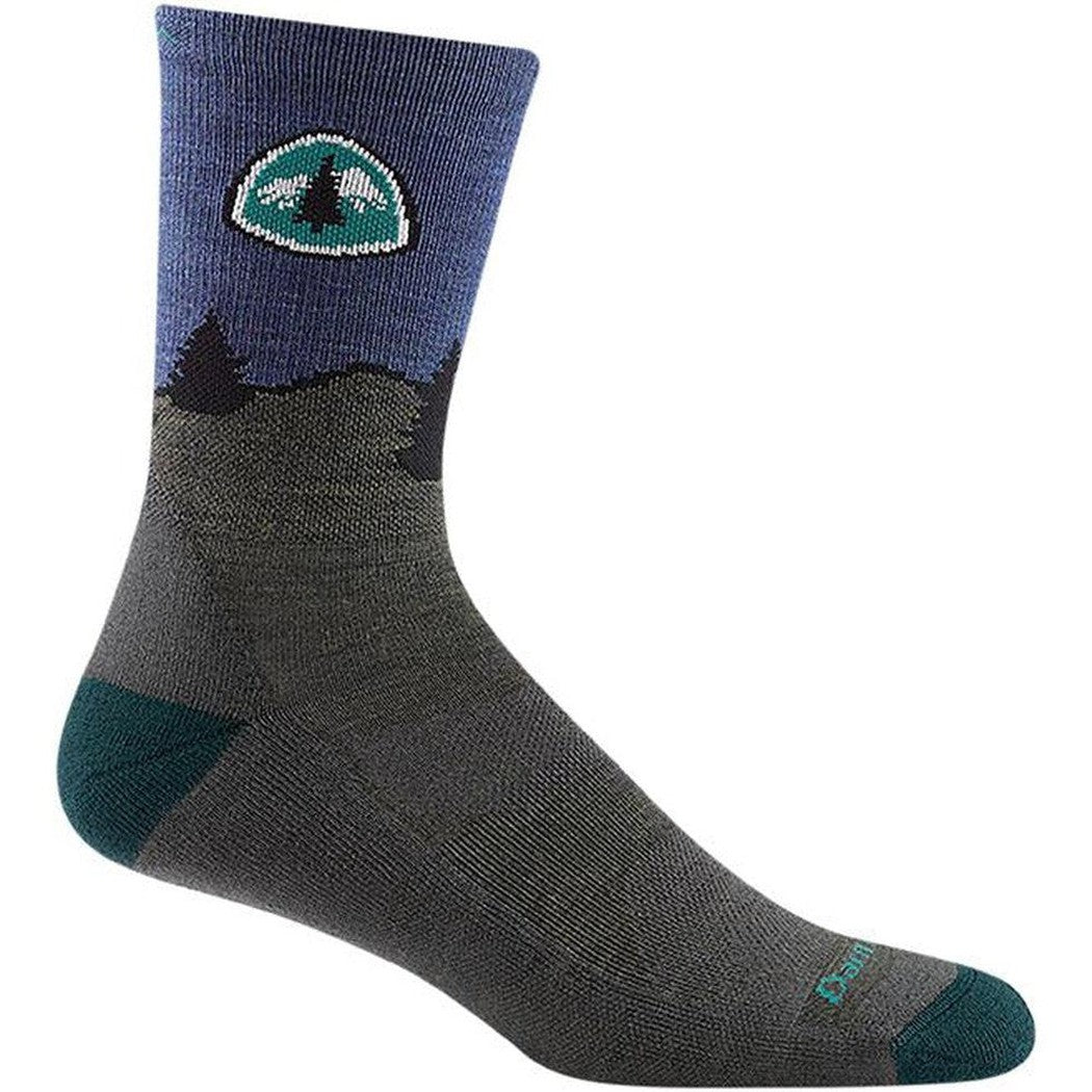 Side view of the Darn Tough Men's PCT Micro Crew Lightweight with Cushion socks in Forest color showing the tree logo and mountain design on a white background.