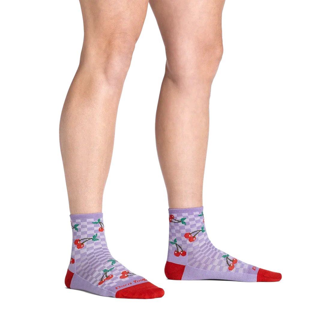 A front view of the Darn Tough Women's Fruit Stand Shorty Lightweight Lifestyle Sock in Country Blue on a model with a white background.