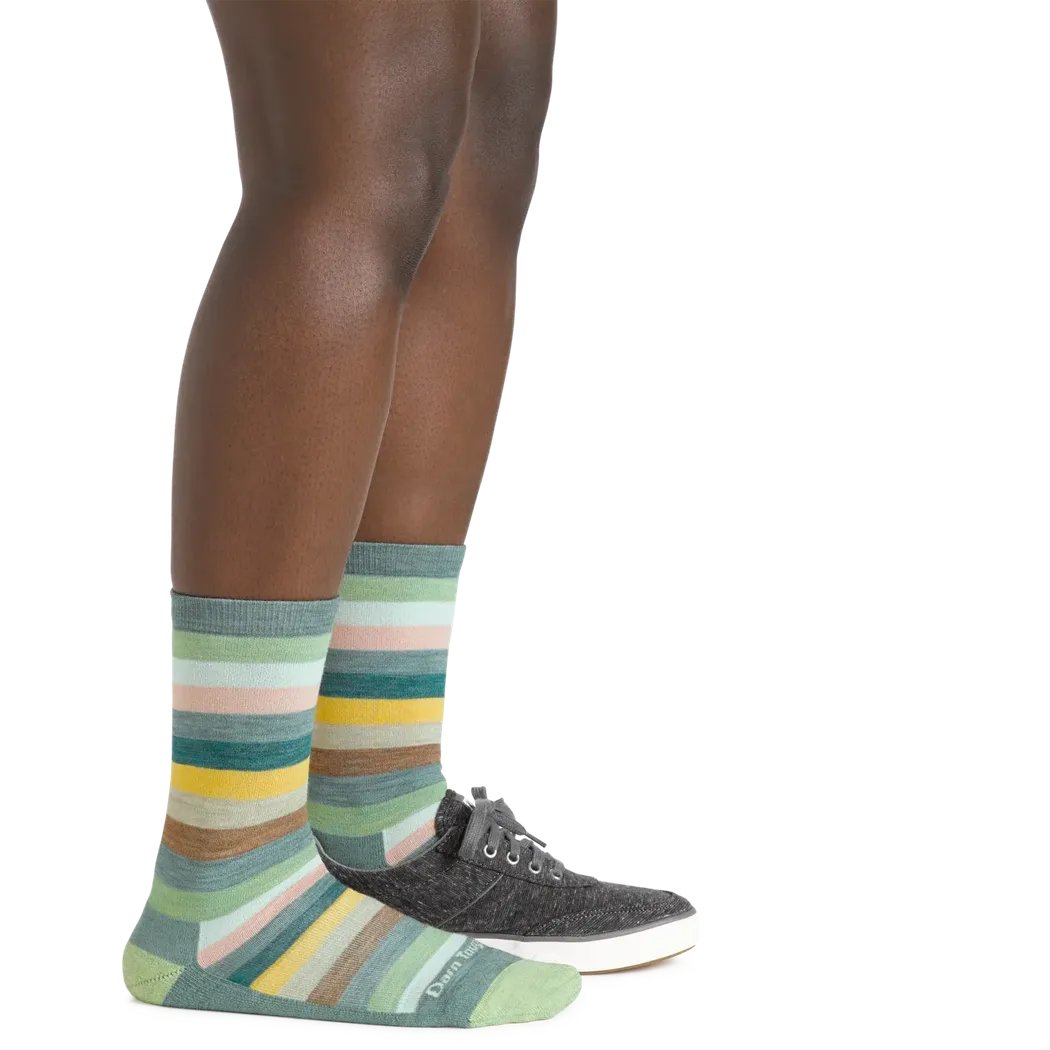 Side view of the Darn Tough Women's Mystic Stripe Crew Lightweight Lifestyle Sock in Ash on a model against a white background.