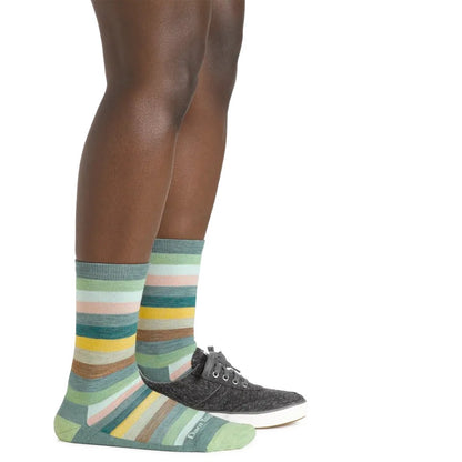 Side view of the Darn Tough Women's Mystic Stripe Crew Lightweight Lifestyle Sock in Ash on a model against a white background.