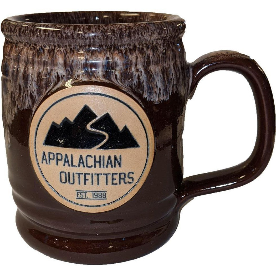 A side view of the Cranberry Deneen Pottery Appalachian Outfitters Mug showing the logo and handle against a white background.