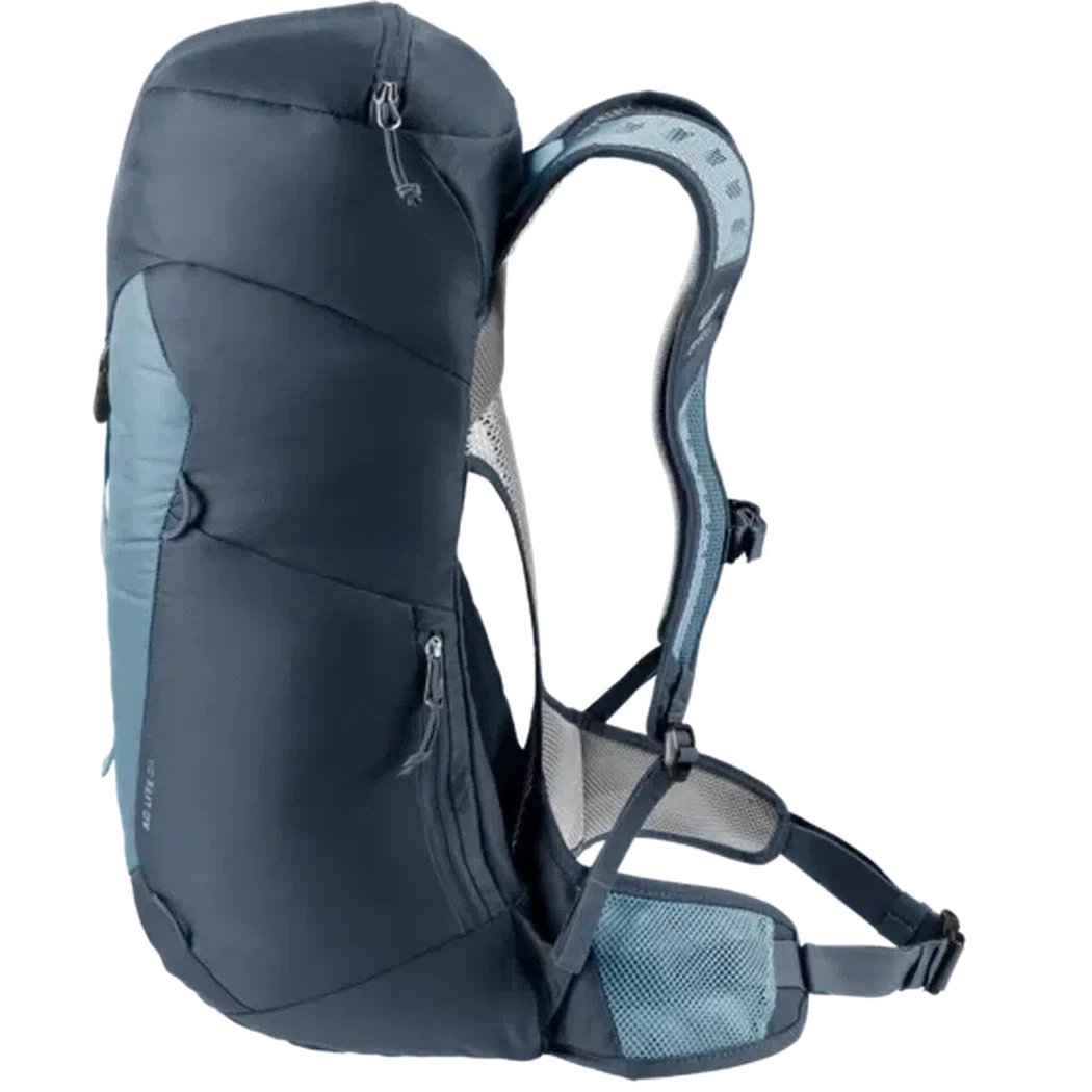 Side view of the Deuter AC Lite 24 in Atlantic Ink showing the padded shoulder straps and mesh hip belt against a white background.
