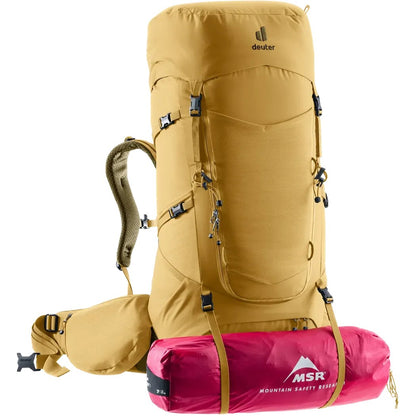 Side view of the Deuter Aircontact Core 55+10 SL in Savanna Nori showing the front pocket and attached pink MSR sleeping bag against a white background.