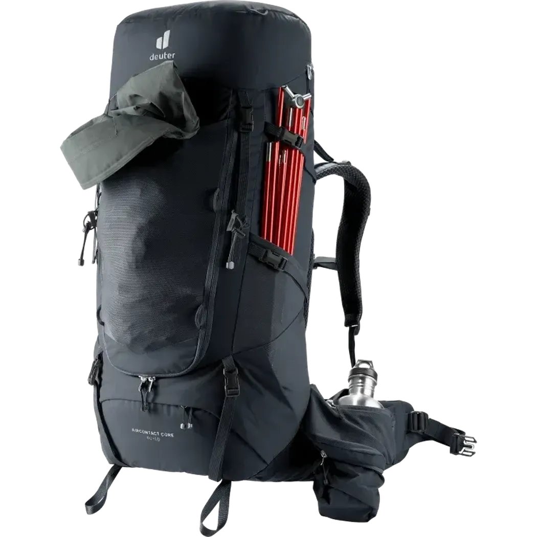 Side view of the Deuter Aircontact Core 60+10 black backpack showing red trekking poles and a water bottle on the hip belt against a white background.
