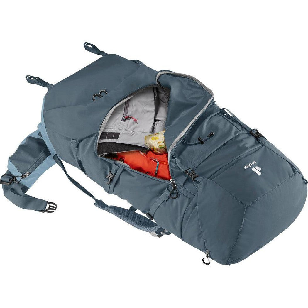 A top-down view of the Deuter Aircontact Core 65 + 10 backpack in Graphite Shale, showing its main compartment open with an orange item inside, against a white background.