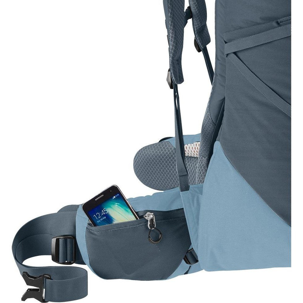 Side view of the Deuter Aircontact Core 65 + 10 in Graphite Shale showing the front pocket with a phone inside against a white background.