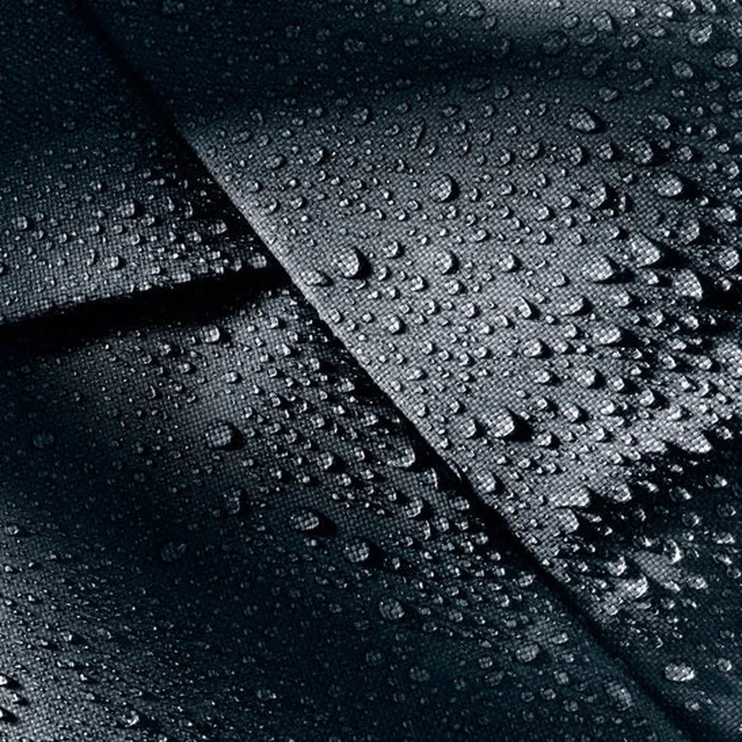 The Deuter Duffel Pro Movo 36 in Black shows water droplets on its surface from a top-down angle.
