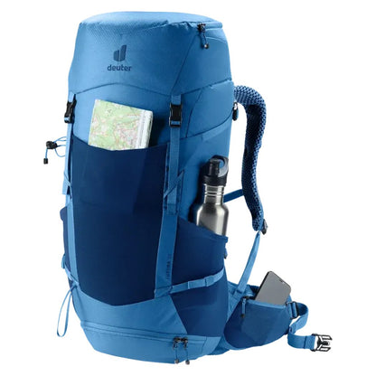 Side view of the Deuter Futura 32 in Nightblue Baltic showing a map and water bottle in pockets against a white background.