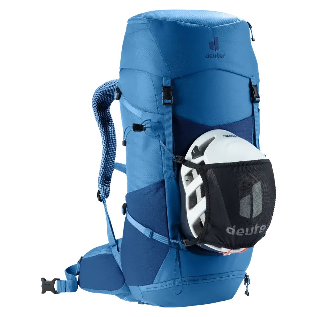 Side view of the Deuter Futura 32 in Nightblue Baltic showing the helmet pocket and padded shoulder straps against a white background.