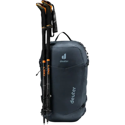 A side view of the Deuter Speed Lite Pro 19 black backpack with trekking poles attached, photographed against a white background.