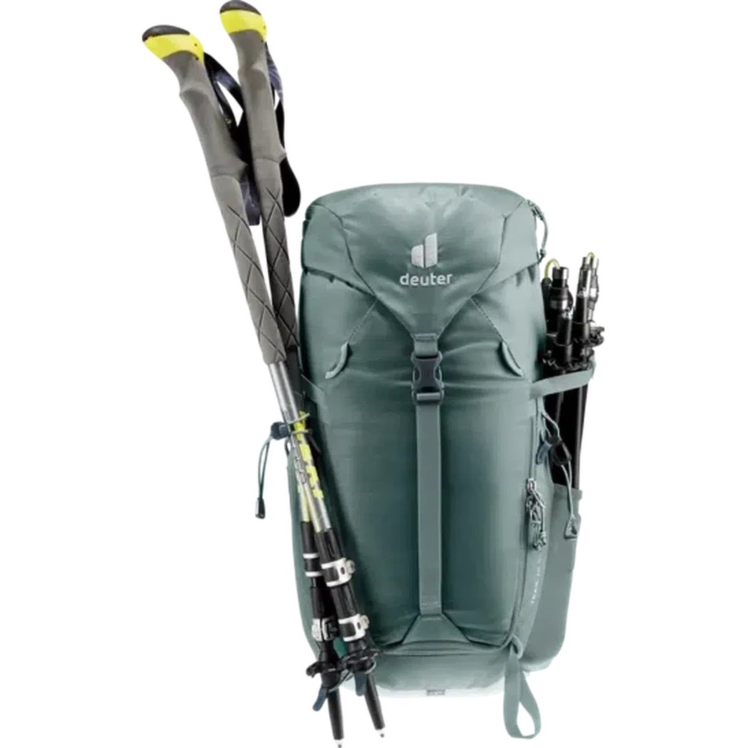 A front view of the Deuter Trail 16 SL backpack in Teal Tin with trekking poles attached and a white background.