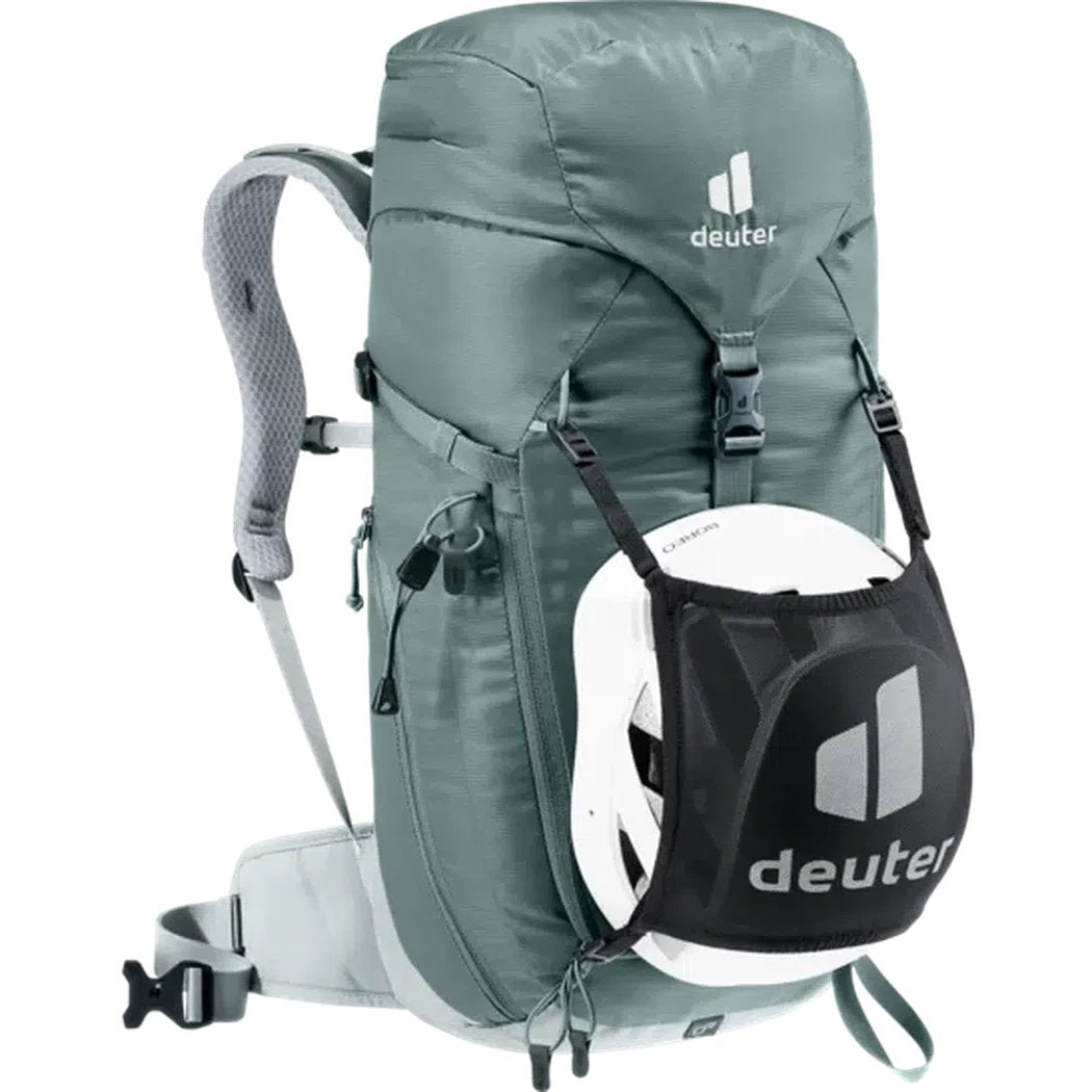 A front view of the Deuter Trail 22 SL backpack in Teal Tin with a helmet in the front pocket against a white background.
