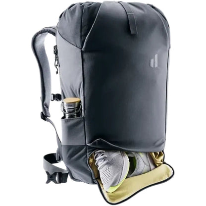 A charcoal Deuter Utilion 34+5 backpack shows a shoe compartment and water bottle pocket against a white background.