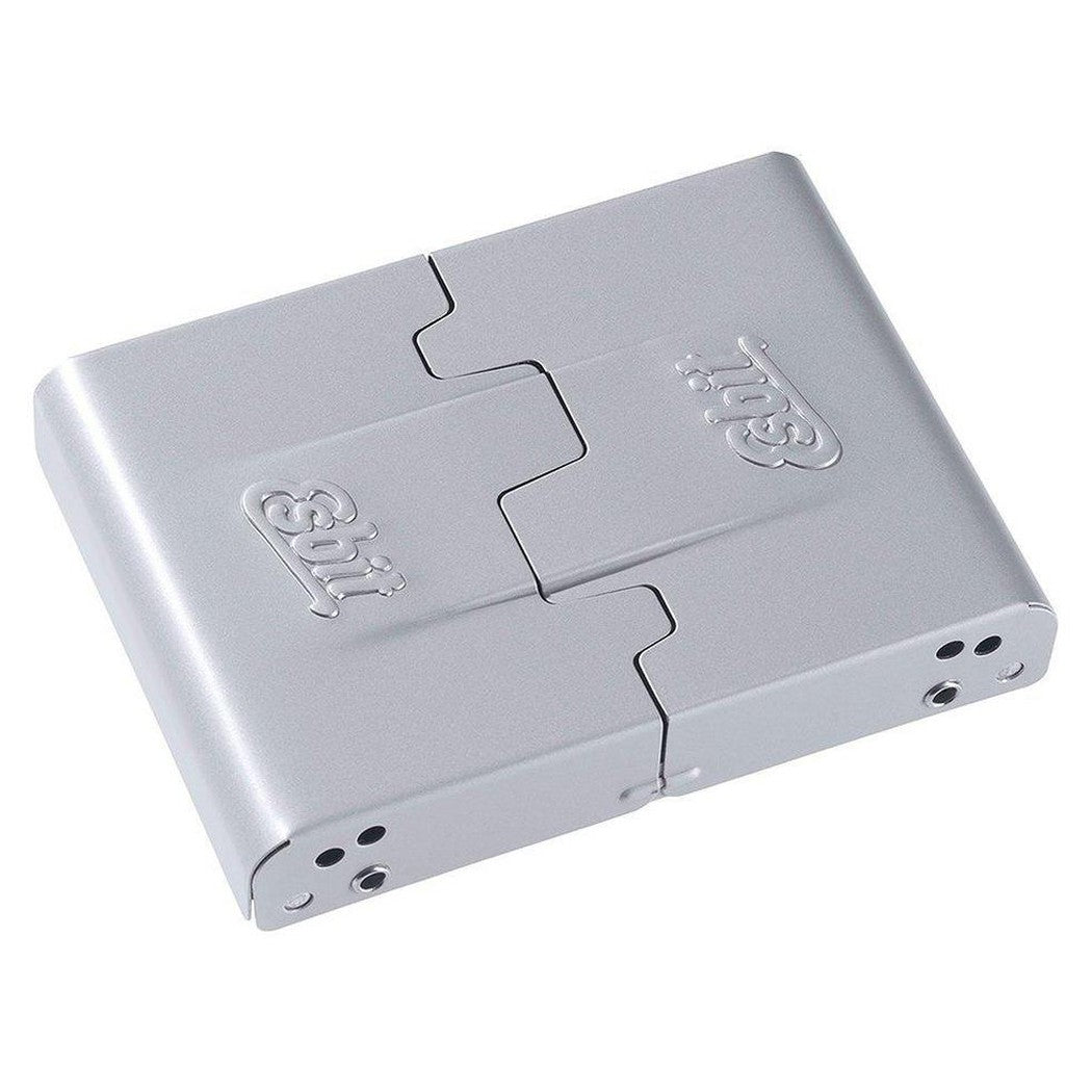 A top-down view of the silver Esbit Medium Pocket Stove with its hinged design and ventilation holes visible.
