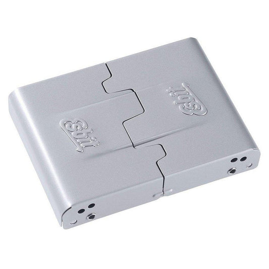 A top-down view of the silver Esbit Medium Pocket Stove with its hinged design and ventilation holes visible.