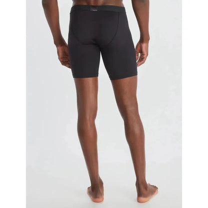 Back view of the Exofficio Men's Give-N-Go Sport 2.0 Boxer Brief 9" in Black/Black on a barefoot model against a white background.