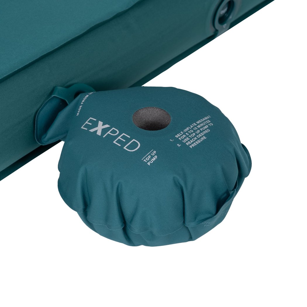 Close-up of the teal Exped MegaMat Duo showing the pump attached to the sleeping pad.